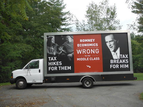 A Mobile Billboard Of A Political Campaign out on the streets to be seen by a multitude of people.